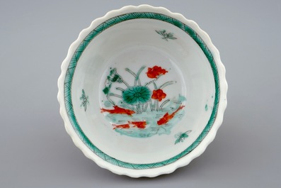 A Chinese famille verte and caf&eacute; au lait cup and saucer, Kangxi